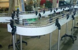 Пластинчатый конвейер для транспортировки бутылок с подсолнечным маслом - фото 2